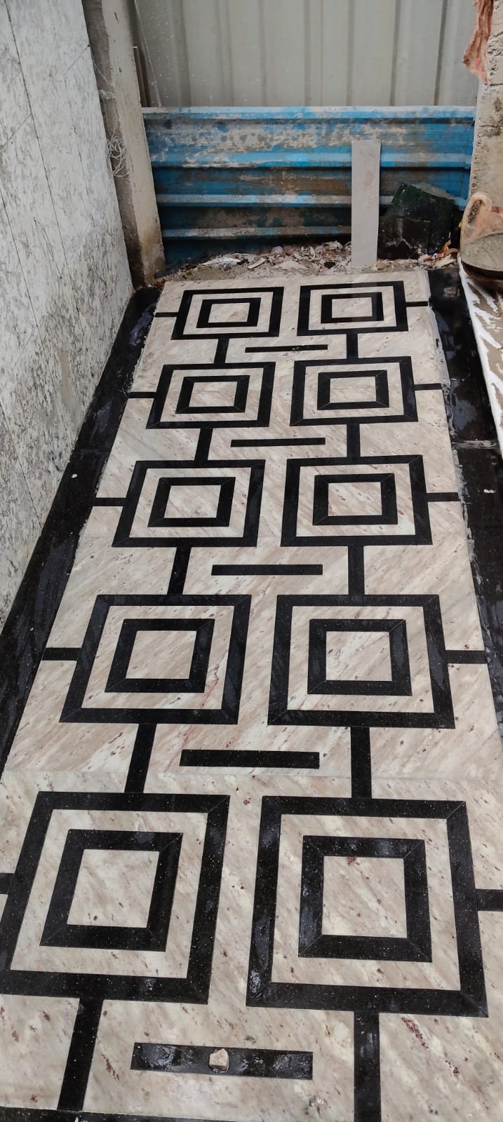 Finished geometric marble star inlay pattern in luxury living room in DLF Phase 5 Gurugram
